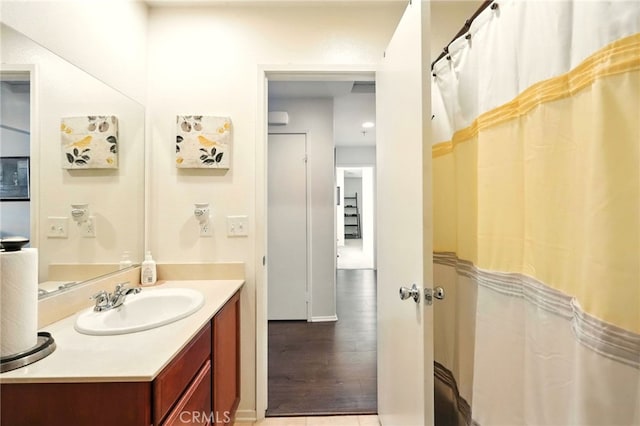 6875 Adainville Dr, Palmdale, CA 93552 - bathroom with vanity and wood finished floors