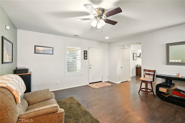 6875 Adainville Dr, Palmdale, CA 93552 - living room featuring dark wood finished floors and a ceiling fan