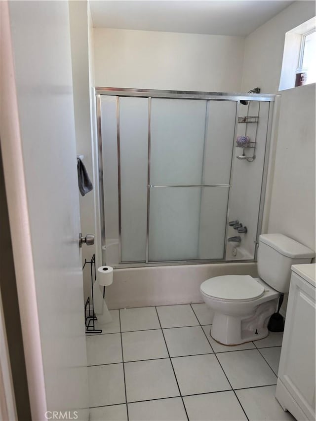 2622 E 129th St, Compton, CA 90222 - bathroom featuring toilet, bath / shower combo with glass door, tile patterned flooring, and vanity