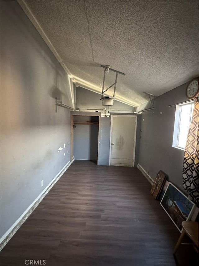 2622 E 129th St, Compton, CA 90222 - garage featuring a garage door opener and baseboards
