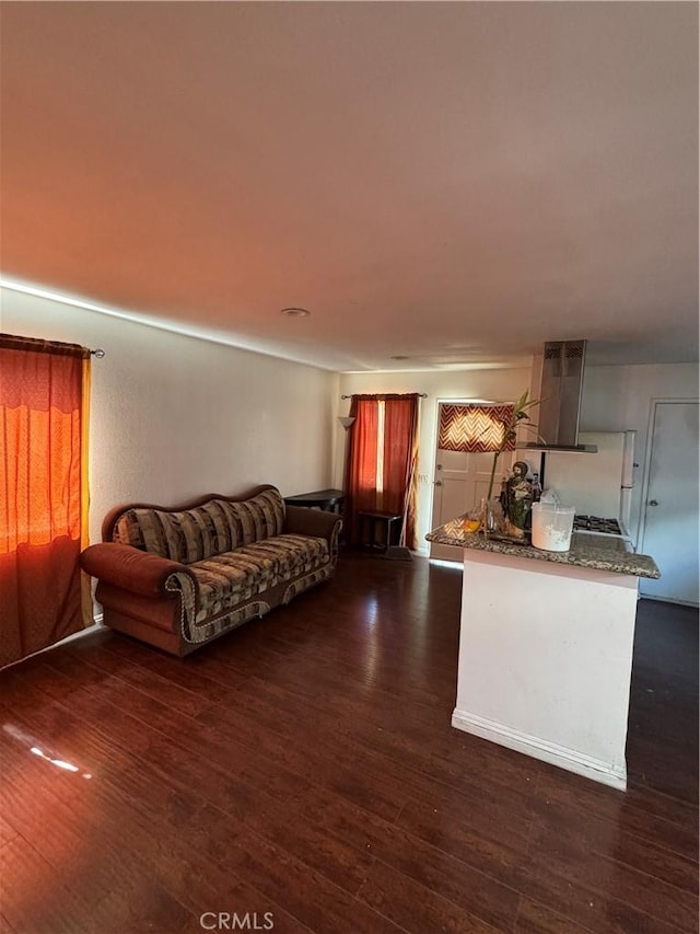 2622 E 129th St, Compton, CA 90222 - living area featuring dark wood-type flooring