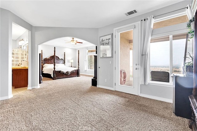 22428 Valley View Rd, Apple Valley, CA 92308 - unfurnished bedroom with arched walkways, carpet floors, baseboards, and access to exterior