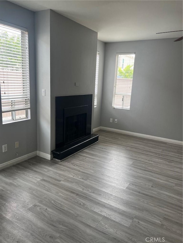 4816 S Fork Rd, Chino, CA 91719 - unfurnished living room featuring wood finished floors and a fireplace with raised hearth