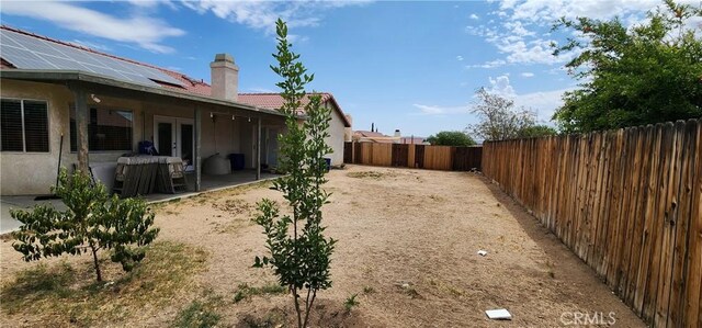 15009 Hopland St, Victorville, CA 92394 - fenced backyard with french doors and a patio area