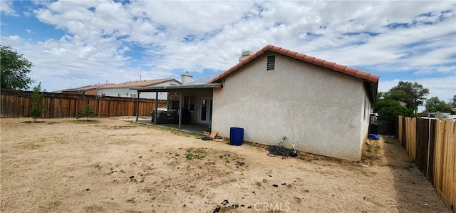 15009 Hopland St, Victorville, CA 92394 - back of property with a fenced backyard and stucco siding