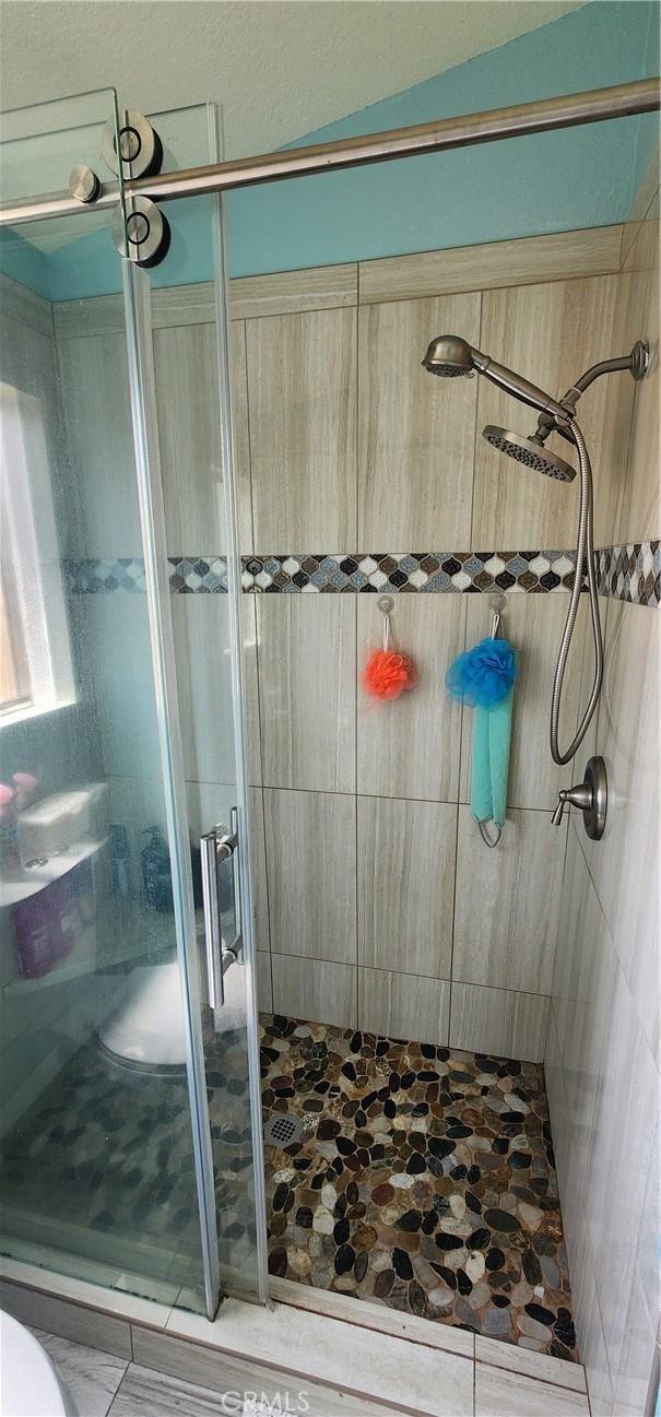 15009 Hopland St, Victorville, CA 92394 - bathroom featuring a stall shower