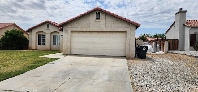 15009 Hopland St, Victorville, CA 92394 - mediterranean / spanish home with driveway, a tile roof, a garage, and stucco siding