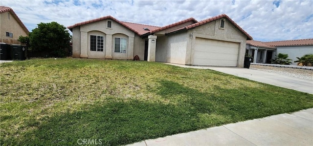 15009 Hopland St, Victorville, CA 92394 - mediterranean / spanish house with a tiled roof, an attached garage, concrete driveway, stucco siding, and a front lawn