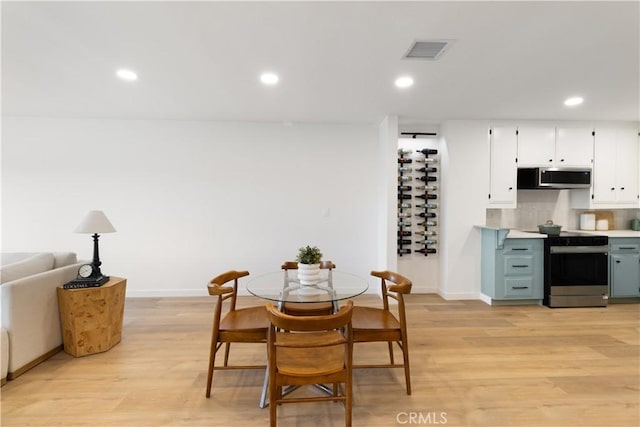 3695 Linden Ave Unit 10C, Long Beach, CA 90807 - dining room featuring light wood-style floors, baseboards, and recessed lighting