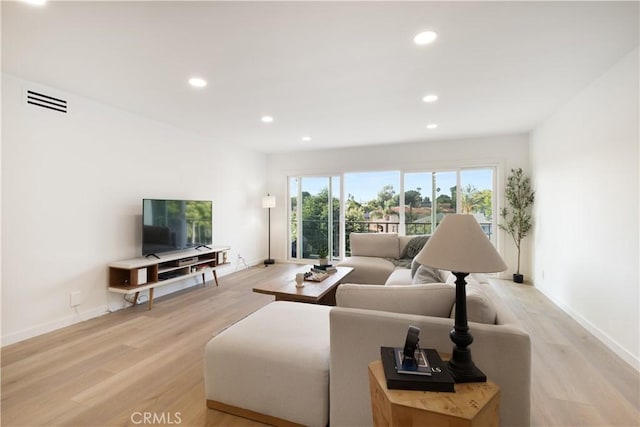 3695 Linden Ave Unit 10C, Long Beach, CA 90807 - living room with light wood finished floors, recessed lighting, and baseboards