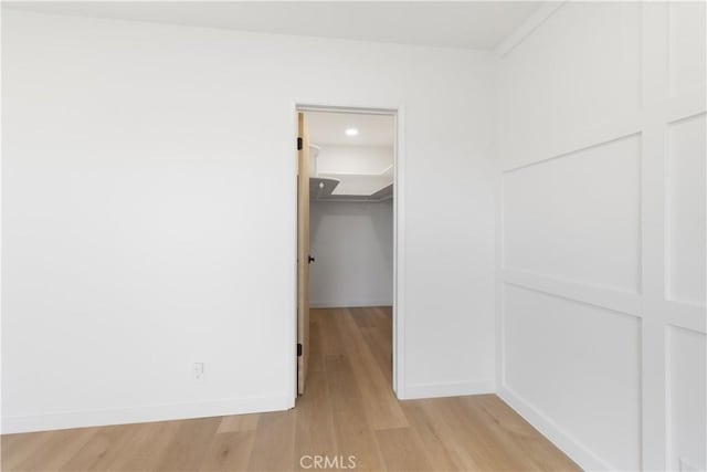 3695 Linden Ave Unit 10C, Long Beach, CA 90807 - spare room featuring light wood-style floors and baseboards
