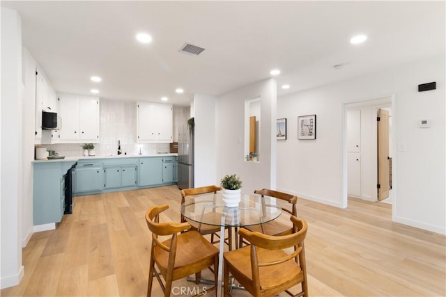 3695 Linden Ave Unit 10C, Long Beach, CA 90807 - dining room with recessed lighting, light wood-style flooring, and baseboards