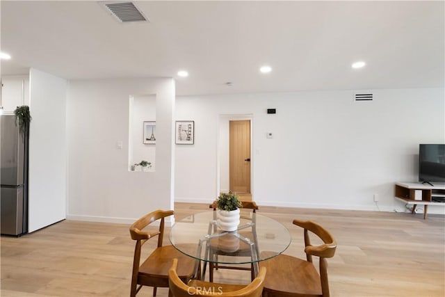 3695 Linden Ave Unit 10C, Long Beach, CA 90807 - dining area with light wood-type flooring, recessed lighting, and baseboards