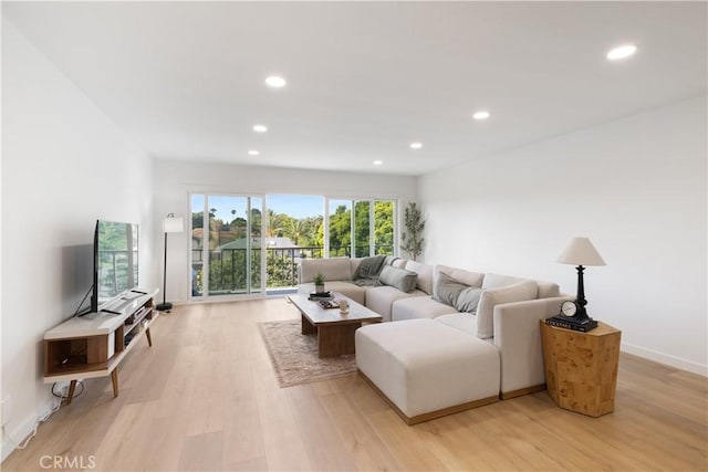 3695 Linden Ave Unit 10C, Long Beach, CA 90807 - living area with recessed lighting, light wood-style flooring, and baseboards