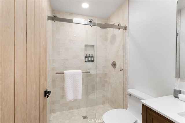 3695 Linden Ave Unit 10C, Long Beach, CA 90807 - bathroom featuring vanity, toilet, a stall shower, and recessed lighting