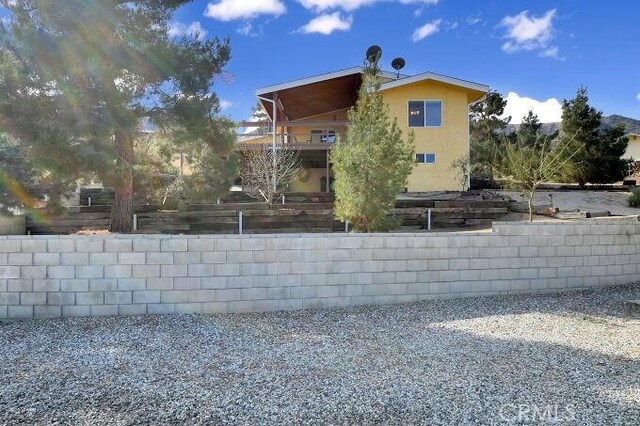28560 Cruthers Creek Rd, Pearblossom, CA 93553 - view of property exterior featuring stucco siding