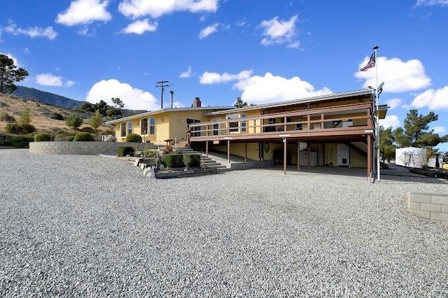 28560 Cruthers Creek Rd, Pearblossom, CA 93553 - rear view of property featuring a carport and a deck