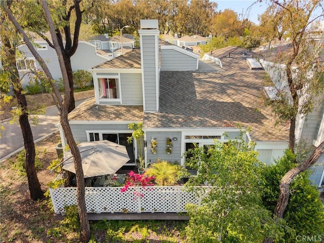 511 San Nicholas Ct, Laguna Beach, CA 92651 - rear view of house with a shingled roof and a chimney
