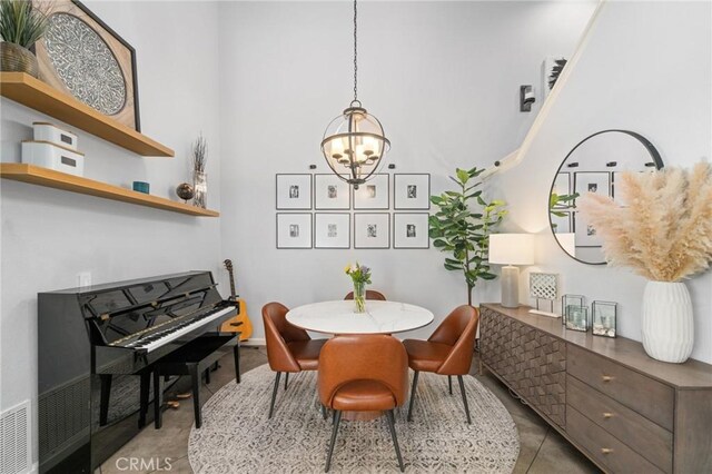 511 San Nicholas Ct, Laguna Beach, CA 92651 - dining space featuring a chandelier and a high ceiling