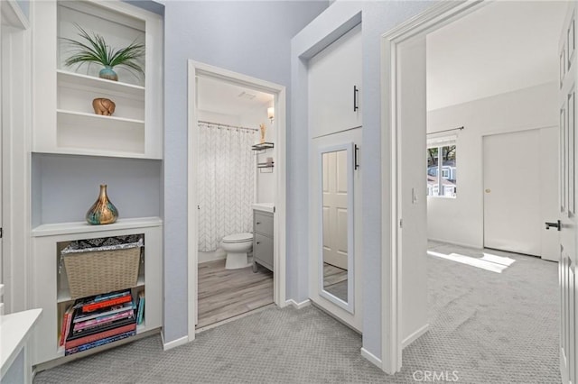 511 San Nicholas Ct, Laguna Beach, CA 92651 - corridor featuring light colored carpet and baseboards