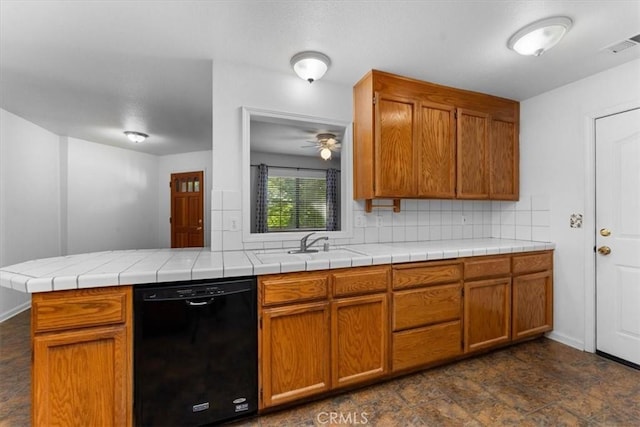 22022 Grove Cir, Red Bluff, CA 96080 - kitchen featuring dishwasher, decorative backsplash, a sink, brown cabinetry, and a ceiling fan