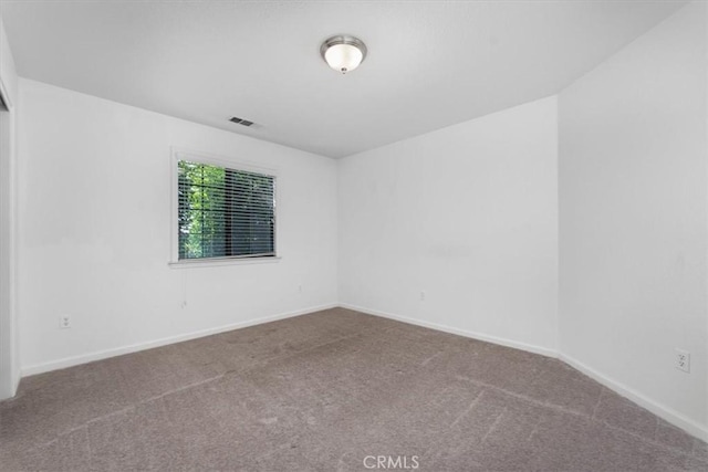 22022 Grove Cir, Red Bluff, CA 96080 - carpeted spare room featuring baseboards