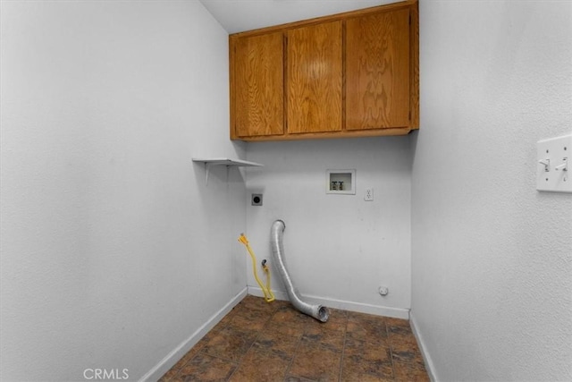 22022 Grove Cir, Red Bluff, CA 96080 - washroom with baseboards, hookup for a gas dryer, washer hookup, cabinet space, and hookup for an electric dryer