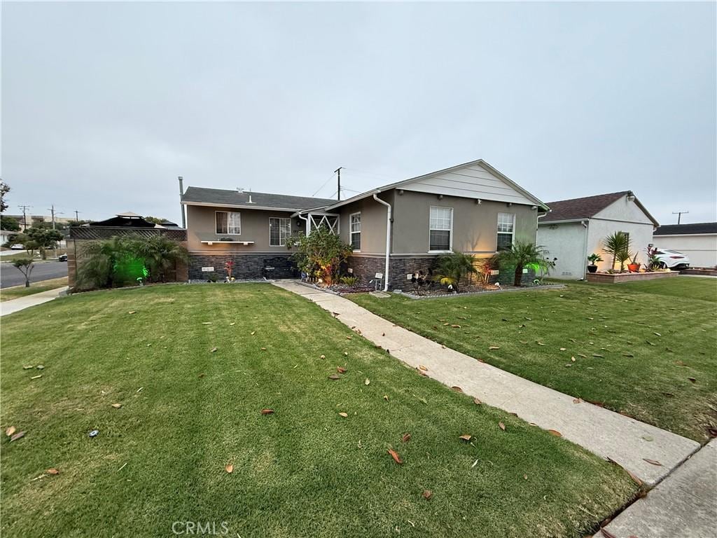 12912 Daleside Ave, Gardena, CA 90249 - single story home featuring stucco siding, a front lawn, and stone siding