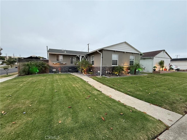 12912 Daleside Ave, Gardena, CA 90249 - single story home featuring stucco siding, a front lawn, and stone siding