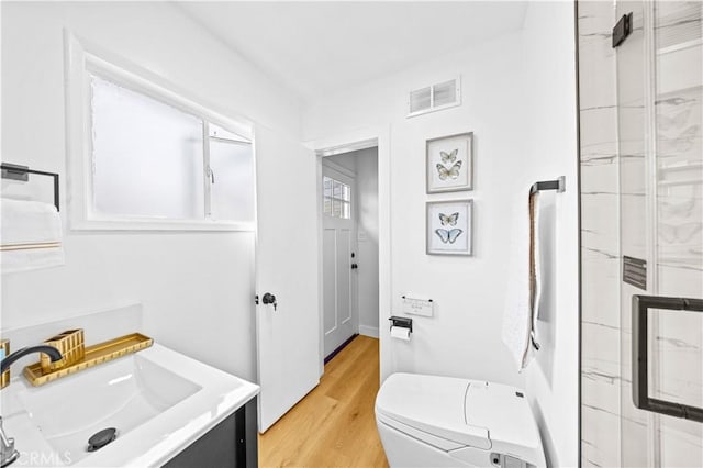 934 W Bonnie Brae Ct, Ontario, CA 91762 - full bath featuring toilet, a shower stall, wood finished floors, and vanity