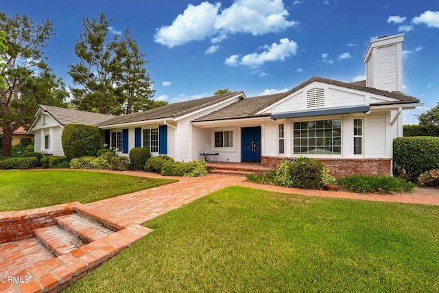 6861 Aviano Dr, Camarillo, CA 93012 - ranch-style home featuring brick siding, a front yard, and a chimney