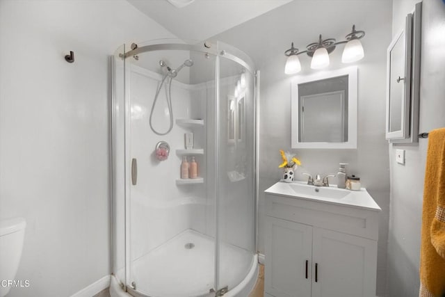 10217 Enger St, Bakersfield, CA 93312 - full bathroom with a stall shower, vanity, toilet, and baseboards