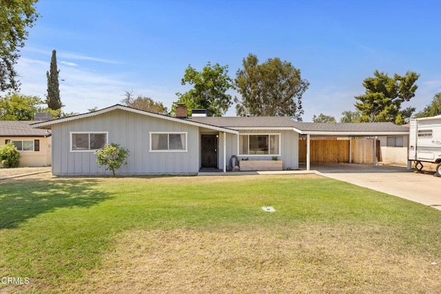 10217 Enger St, Bakersfield, CA 93312 - ranch-style home with a chimney, board and batten siding, an attached carport, and driveway