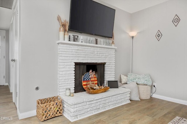 10217 Enger St, Bakersfield, CA 93312 - detailed view of wood finished floors, baseboards, and a fireplace