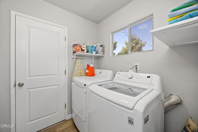 10217 Enger St, Bakersfield, CA 93312 - washroom with washing machine and dryer and light wood-style flooring