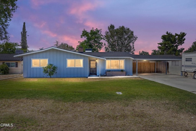 10217 Enger St, Bakersfield, CA 93312 - ranch-style house with board and batten siding, a chimney, an attached carport, and concrete driveway