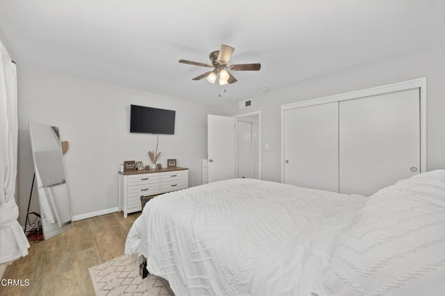 10217 Enger St, Bakersfield, CA 93312 - bedroom with light wood-style flooring, a closet, ceiling fan, and baseboards