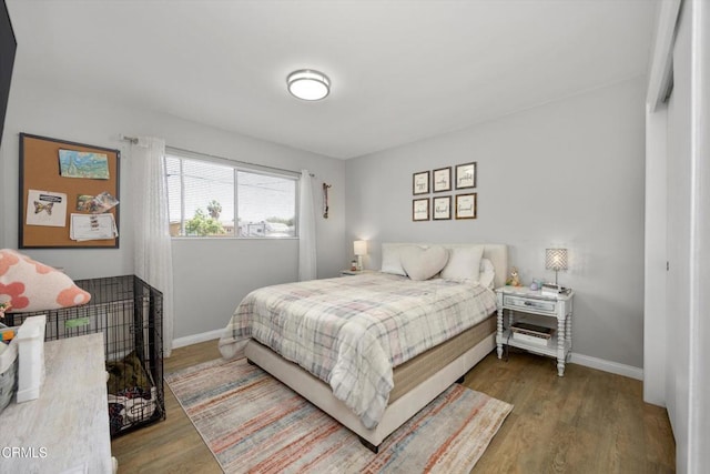 10217 Enger St, Bakersfield, CA 93312 - bedroom featuring baseboards and wood finished floors