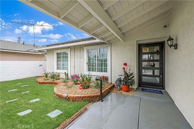10415 Mapledale St, Bellflower, CA 90706 - property entrance with stucco siding and a lawn