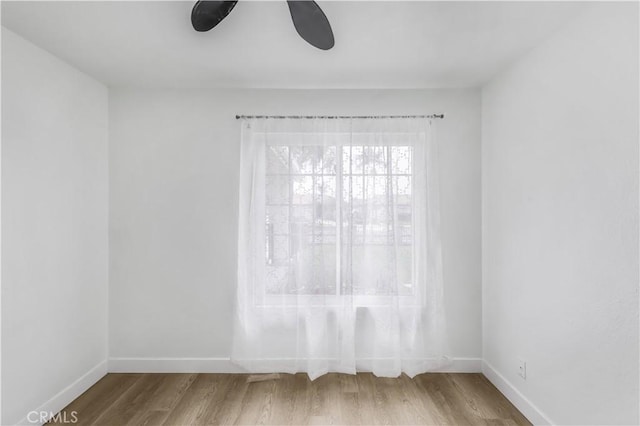 10415 Mapledale St, Bellflower, CA 90706 - unfurnished room with wood finished floors, baseboards, and ceiling fan