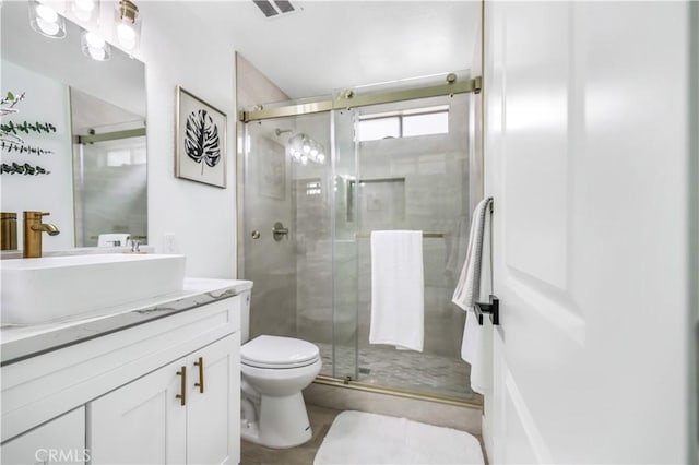 10415 Mapledale St, Bellflower, CA 90706 - full bathroom featuring vanity, toilet, and a shower stall