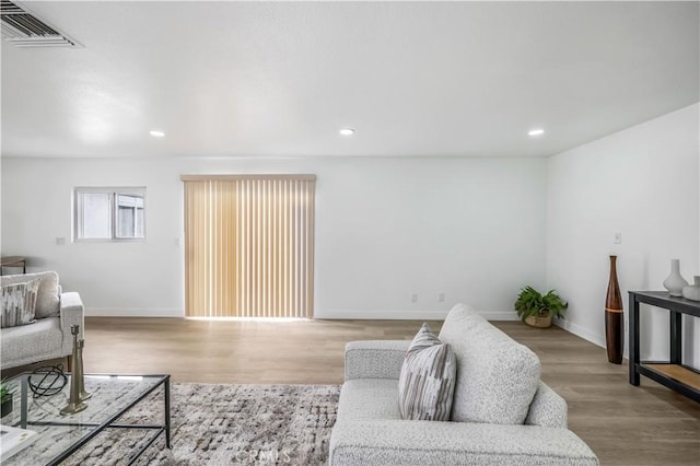 10415 Mapledale St, Bellflower, CA 90706 - living area featuring baseboards, recessed lighting, and wood finished floors