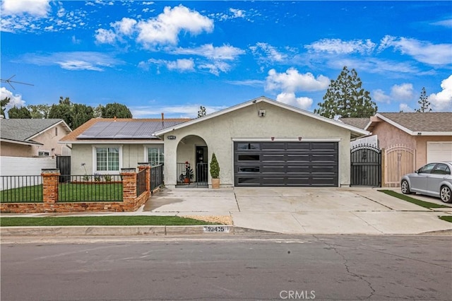 10415 Mapledale St, Bellflower, CA 90706 - single story home featuring a gate, stucco siding, a fenced front yard, and solar panels