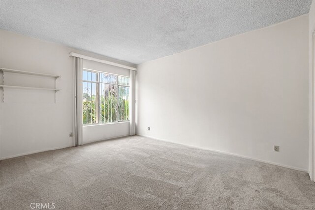 10120 Andasol Ave, Northridge, CA 91325 - empty room featuring carpet flooring and a textured ceiling