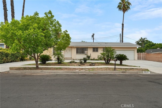 10120 Andasol Ave, Northridge, CA 91325 - ranch-style house featuring driveway and an attached garage
