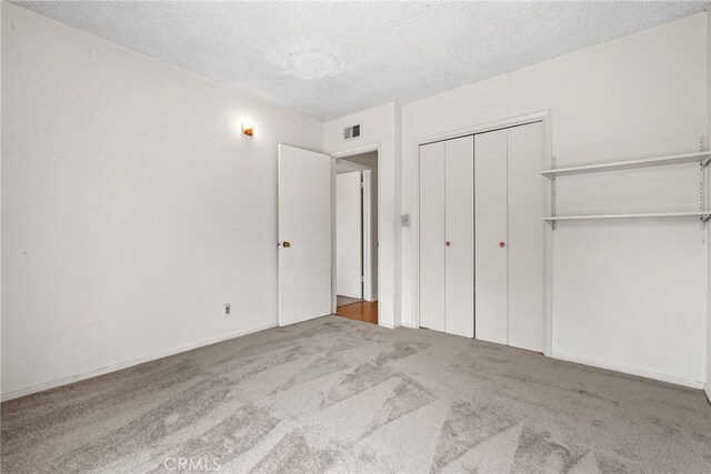 10120 Andasol Ave, Northridge, CA 91325 - unfurnished bedroom with carpet floors, a textured ceiling, and a closet