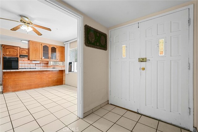 10120 Andasol Ave, Northridge, CA 91325 - entryway featuring light tile patterned flooring and a ceiling fan