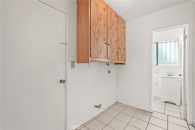 10120 Andasol Ave, Northridge, CA 91325 - laundry area with cabinet space, hookup for a gas dryer, and light tile patterned floors