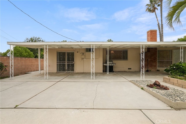 10120 Andasol Ave, Northridge, CA 91325 - rear view of house featuring a chimney, stucco siding, and a patio area