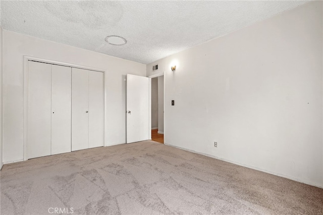 10120 Andasol Ave, Northridge, CA 91325 - unfurnished bedroom featuring carpet flooring, a closet, and a textured ceiling
